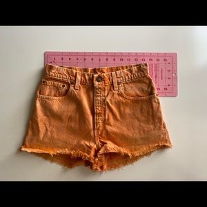 Vintage orange Levi’s cut off shorts